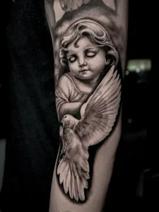 Realistic angel tattoo by Colombian tattoo artist Clayton Goethe